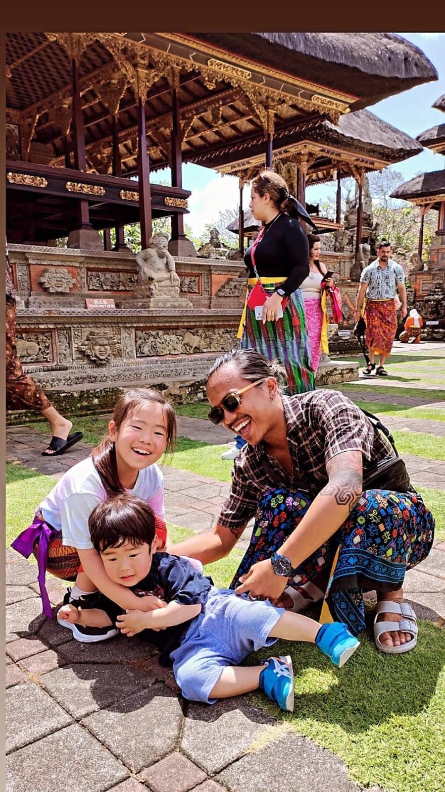 Awan, your local Bali driver, with his children at a Balinese temple