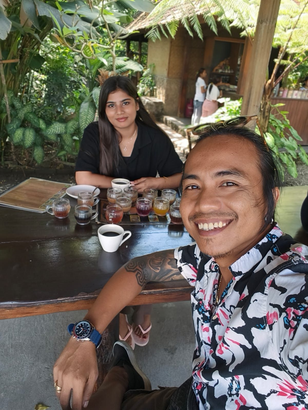 Awan enjoying coffee on a Bali coffee plantation tour